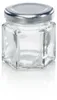 A clear glass hexagonal jar with a silver lid, shown on a white background with a reflection. Voir les images du produit