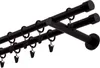 A close-up, angled view of a black, double curtain rod with rings and clips against a white background. Produktbild-Vorschau