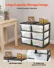 A set of plastic storage drawers filled with colorful items, next to a wooden table with art supplies. Podgląd zdjęcia produktu
