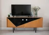 A television set is placed on a wooden media console. There are plants and flowers on top of the console. Produktbild-Vorschau