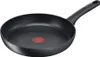 A black frying pan with a red heat indicator in the center, shown from a slightly elevated side angle against a white background. Podgląd zdjęcia produktu