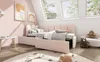 A child's bedroom with a pink bed, toys, and a rug. Podgląd zdjęcia produktu