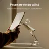 A hand is adjusting a monitor stand, showing its flexibility. Produktbild-Vorschau