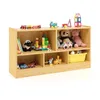 A wooden toy shelf filled with various toys. Produktbild-Vorschau