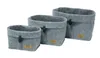 Three grey felt baskets of varying sizes are arranged diagonally on a white background. Produktbild-Vorschau