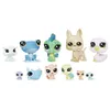 A collection of small, stylized toy animal figures. Podgląd zdjęcia produktu