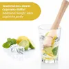 A wooden pestle is shown inside a glass with lime and mint, next to loose limes, a lemon, and ice cubes. Text overlays describe the product's additional benefits. Podgląd zdjęcia produktu