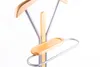 A close-up view of a valet stand with wooden accents and metal frame. Anteprima dell’immagine prodotto