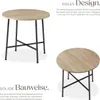 Two views of a round dining table with a wooden top and black metal legs, presented with descriptive text. Náhled obrázku produktu