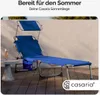 A blue Casaria sun lounger is set up on a wooden deck next to a small table with a drink. Produktbild-Vorschau