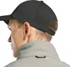 Close-up of a person wearing a baseball cap and a fleece jacket. Produktbild-Vorschau