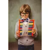 A young boy wearing glasses and a bow tie holds an abacus in front of a green chalkboard. Produktbild-Vorschau