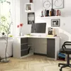 A modern corner desk setup in a bright room with a window and plants. Produktbild-Vorschau