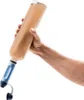 A hand holding a water filter bottle filled with murky water. Podgląd zdjęcia produktu