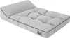 A light gray dog bed with a tufted surface and a raised headrest, shown from a diagonal angle on a white background. Produktbild-Vorschau
