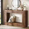 A wooden console table in a hallway with decorative items. Produktbild-Vorschau