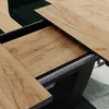 A close-up view of an extendable dining table with a wood grain finish. Anteprima dell’immagine prodotto