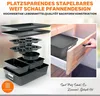 A collection of stacked baking pans and a drawer with a baking pan inside. Produktbild-Vorschau