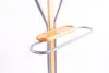 A close-up shot of a valet stand with a wooden tray and a metal bar. Anteprima dell’immagine prodotto