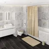 A modern bathroom with marble tiles, a white vanity, toilet, and bathtub with a patterned shower curtain. Produktbild-Vorschau
