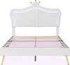 A white bed frame with a crown-shaped headboard and LED lighting. Náhľad obrázku produktu