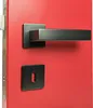 A close-up shot of a door handle and keyhole on a red door. Produktbild-Vorschau
