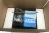 The image shows the contents of a box, including a steam cleaner, a manual, and accessories, all packed with foam padding. Podgląd zdjęcia produktu
