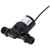 A black water pump with threaded connectors on both ends and a black cable extending from the top. Voir les images du produit