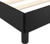 A close-up view of the corner of a black bed frame with wooden slats visible inside. Náhled obrázku produktu