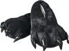 A pair of black, fuzzy slippers shaped like monster paws with shiny black claws. Náhled obrázku produktu