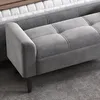 A close-up view of a gray upholstered bench with tufted detailing. Anteprima dell’immagine prodotto