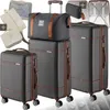 A collection of luggage items, including suitcases and a duffel bag, arranged together. Náhled obrázku produktu