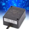 A black electronic power unit with labels and wires, set against a blue, abstract background with circuit board patterns. Náhled obrázku produktu