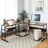 An L-shaped desk with a computer, laptop, and books, set up in a home office environment. Podgląd zdjęcia produktu