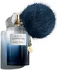 A bottle of Goutal Nuit et Confidences Eau de Parfum for women, with a fluffy navy blue pom-pom accessory attached to the cap. Produktbild-Vorschau