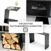 A collage of four images showcasing a black C-shaped metal side table in different settings: with a book and wine glass, next to a sofa with a remote and phone, holding firewood, and a standalone view. Produktbild-Vorschau