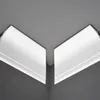 A corner of a room showing two pieces of white crown molding with integrated LED lighting. Produktbild-Vorschau