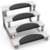 A four-step stair mat set with dark gray, curved treads on white steps, set against a white background. Produktbild-Vorschau