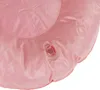 A close-up of a pink inflatable object with an air valve. Produktbild-Vorschau