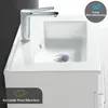 A close-up view of a white ceramic sink with a chrome faucet and drain. Produktbild-Vorschau