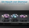 A close-up of a smartphone camera lens protector set with decorative rhinestones, presented on a dark surface. Produktbild-Vorschau
