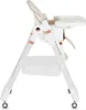 A side view of a white baby high chair with rose gold accents. Náhled obrázku produktu