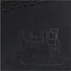 A close-up embossed image of a bulldozer on a black background. Voir les images du produit