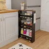 A narrow rolling cart filled with kitchen items is placed between a cabinet and a refrigerator in a kitchen. Voir les images du produit