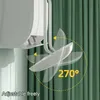 A close-up view of a white air conditioner wind deflector attached to a wall, with animated arcs showing its adjustable range. Náhľad obrázku produktu