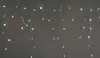 A string of icicle-shaped LED lights hanging against a plain background. Produktbild-Vorschau