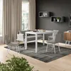 A dining room setting with a table, chairs, and a sofa. Náhled obrázku produktu