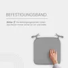 A hand is shown pressing on a gray seat cushion, demonstrating its softness. Text describes the fastening straps. Produktbild-Vorschau