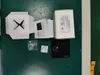 The image shows the contents of a product box laid out on a green surface. Podgląd zdjęcia produktu