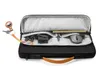 An open laptop bag with accessories inside. Náhľad obrázku produktu